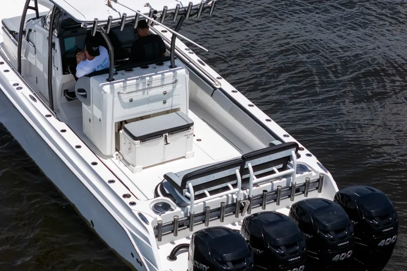 Slide: The Image of 2018 Nor-Tech 392 Super Fish boat with multiple outboard engines on water. - 49