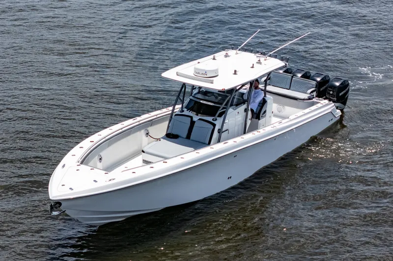 Slide: The Image of 2018 Nor-Tech 392 Super Fish boat cruising on water, featuring sleek design and powerful engines. - 41