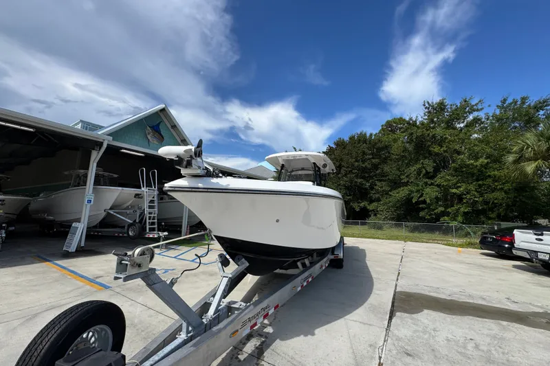 Slide: The Image of 2024 Fountain 34 Center Console boat on trailer under clear sky. - 6