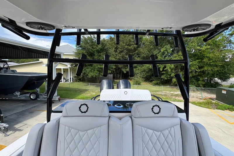 Slide: The Image of 2024 Fountain 34 Center Console boat interior with seating and rod holders. - 37