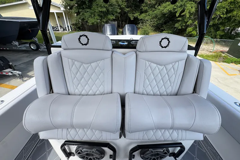 Slide: The Image of 2024 Fountain 34 Center Console boat seats with diamond stitching and logo embroidery. - 36