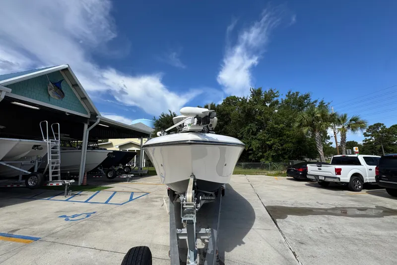 Slide: The Image of 2024 Fountain 34 Center Console boat on trailer in sunny marina. - 7
