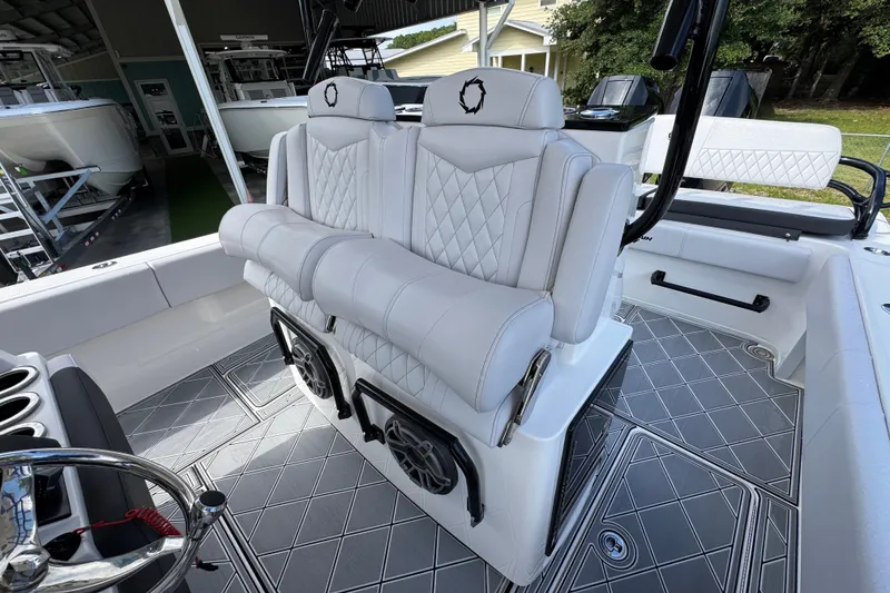 Slide: The Image of 2024 Fountain 34 Center Console boat interior with luxurious white seating and modern design. - 35