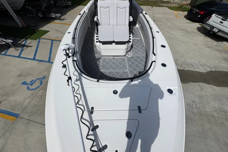 Slide: The Image of 2024 Fountain 34 Center Console boat with sleek deck design and seating area. - 24