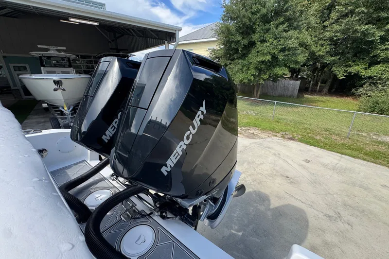 Slide: The Image of 2024 Fountain 34 Center Console with dual Mercury outboard engines. - 46