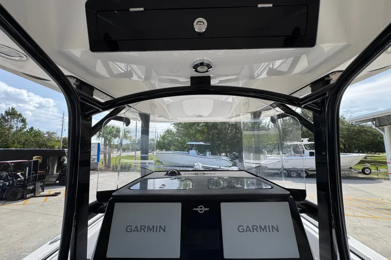 Slide: The Image of 2024 Fountain 34 Center Console boat interior with Garmin navigation system. - 33