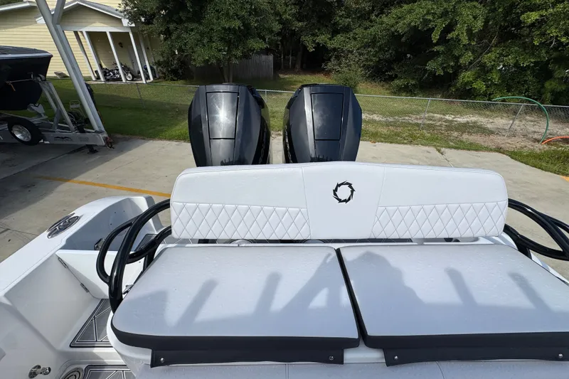 Slide: The Image of 2024 Fountain 34 Center Console boat with dual engines and cushioned seating. - 45