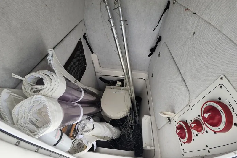 Slide: The Image of Storage compartment of a 2005 Regulator 26 Forward Seating boat with equipment and controls. - 22