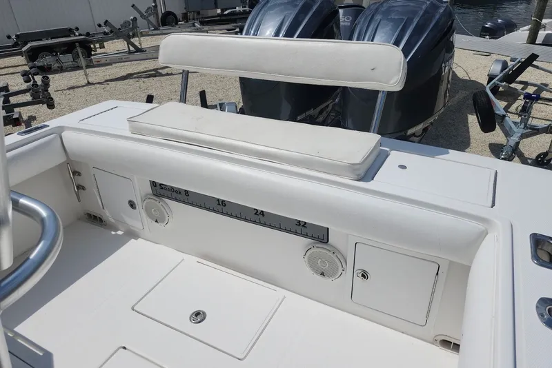 Slide: The Image of 2005 Regulator 26 Forward Seating boat interior with dual engines and storage compartments. - 17