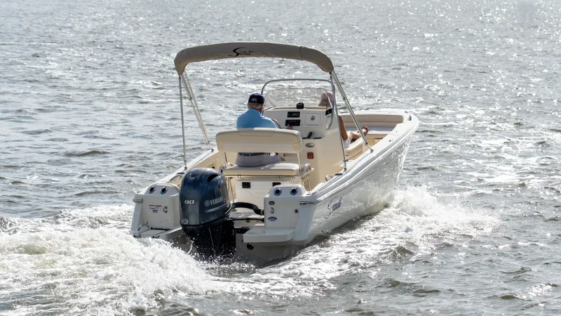 Slide: The Image of A 2027 Scout 188 Sportfish boat cruising on sunny waters. - 45