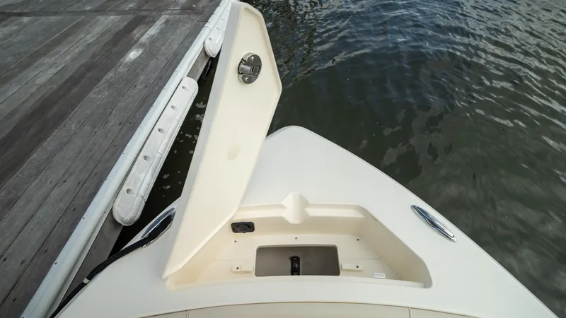 Slide: The Image of Bow view of the Scout 188 Sportfish with an open storage hatch. - 20