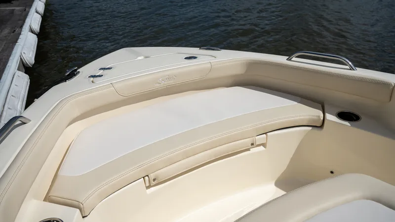 Slide: The Image of The 2027 Scout 188 Sportfish features a cream-colored seating area at the bow. - 7