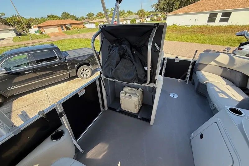 Slide: The Image of 2020 Sylvan Mirage 822 LZ pontoon boat interior with seating and storage compartments. - 21