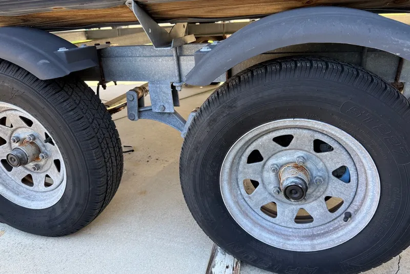 Slide: The Image of Trailer wheels of a 2020 Sylvan Mirage 822 LZ boat. - 24
