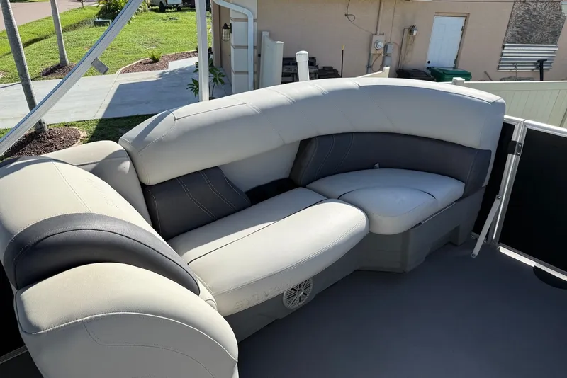Slide: The Image of 2020 Sylvan Mirage 822 LZ boat interior with plush seating and modern design. - 16