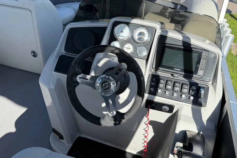 Slide: The Image of Steering console of 2020 Sylvan Mirage 822 LZ boat with gauges and Garmin display. - 13