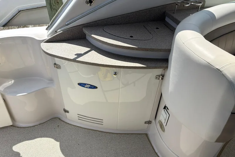 Slide: The Image of 2005 Four Winns 348 Vista boat interior with seating and storage area. - 11