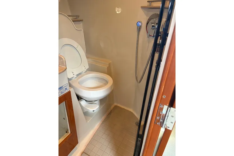 Slide: The Image of Compact bathroom in 2005 Four Winns 348 Vista boat with toilet and shower. - 17