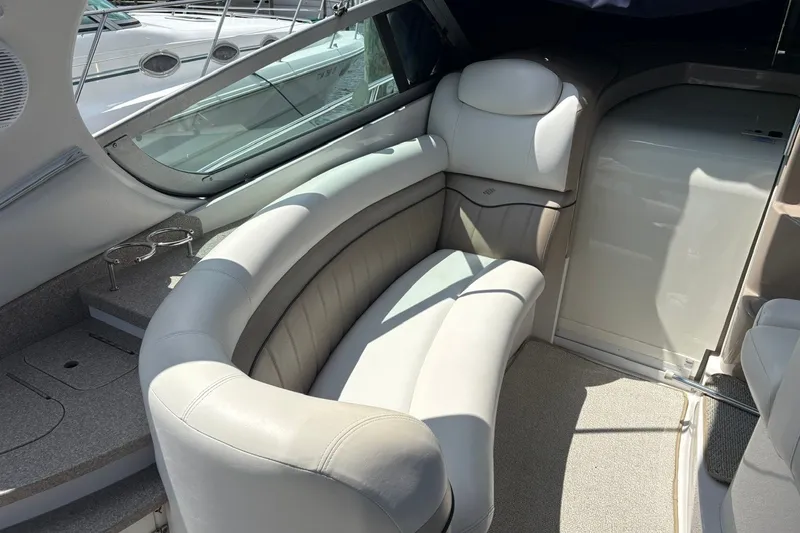 Slide: The Image of 2005 Four Winns 348 Vista boat interior with plush seating and modern design. - 8
