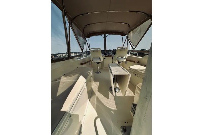 Slide: The Image of Interior view of a 1996 Sabreline 36 Sedan boat with seating and helm. - 83