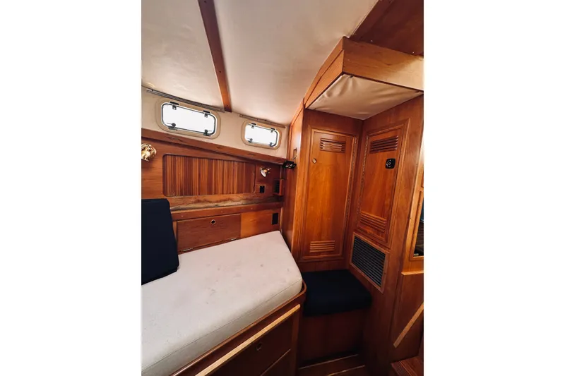 Slide: The Image of 1996 Sabreline 36 Sedan cabin interior with wooden finish and cozy sleeping area. - 40