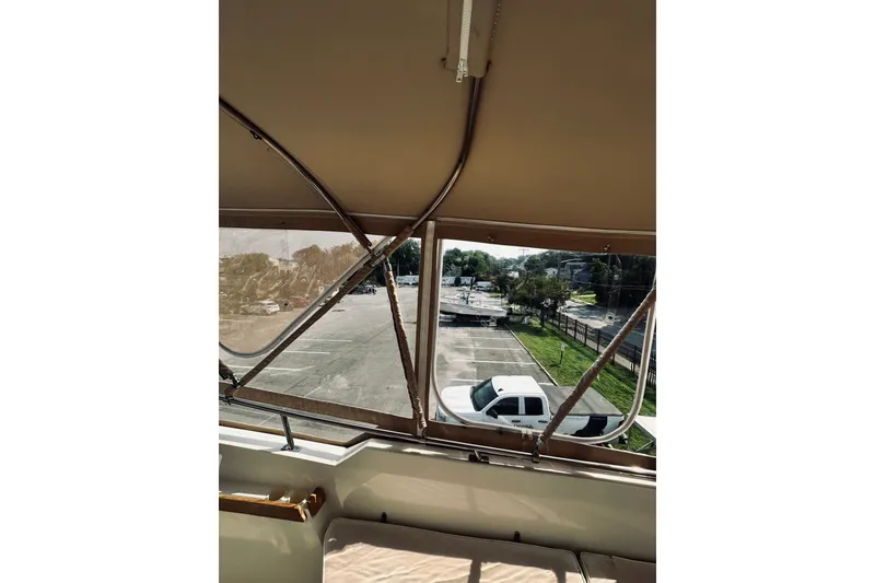 Slide: The Image of View from 1996 Sabreline 36 Sedan, overlooking parking lot and white truck. - 98