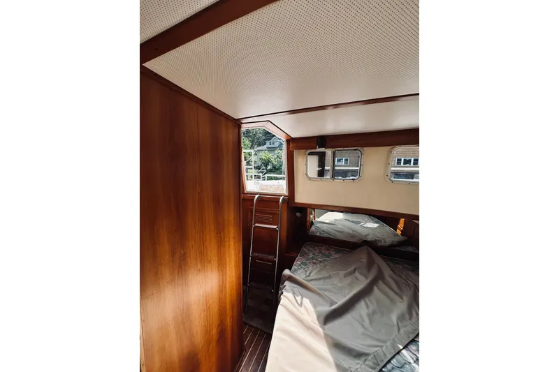 Slide: The Image of Interior of 1996 Sabreline 36 Sedan boat with wooden paneling and windows. - 55