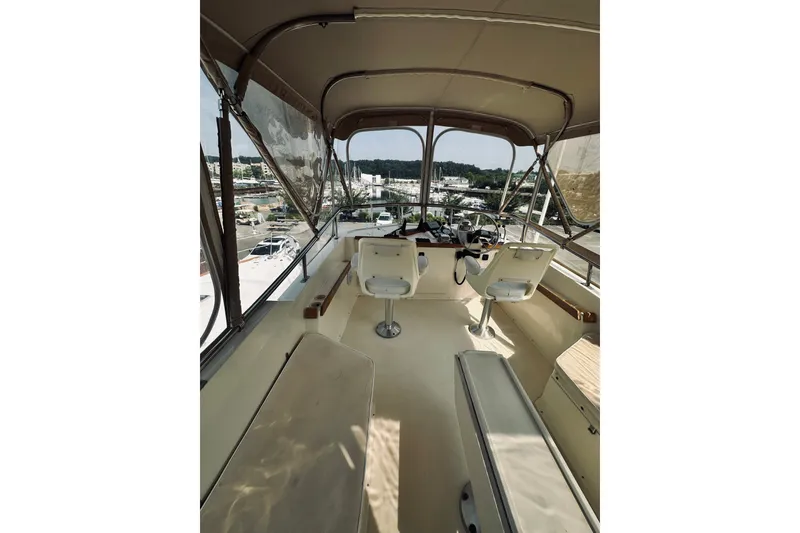 Slide: The Image of Interior view of 1996 Sabreline 36 Sedan boat with helm and seating area. - 87