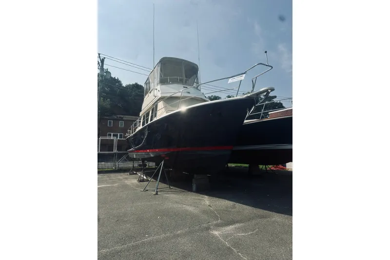Slide: The Image of 1996 Sabreline 36 Sedan boat on dry dock, side view. - 84