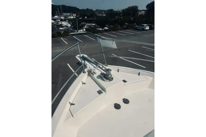 Slide: The Image of Bow view of 1996 Sabreline 36 Sedan yacht in a parking lot. - 14