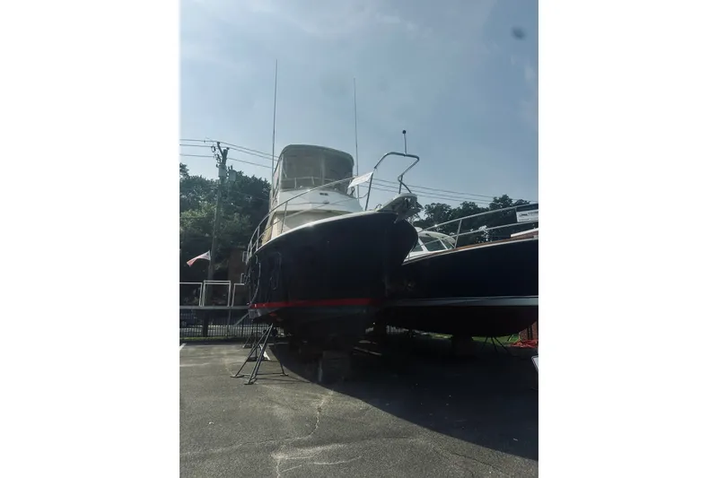 Slide: The Image of 1996 Sabreline 36 Sedan boat on dry dock under clear sky. - 107