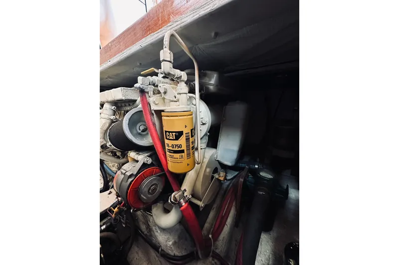Slide: The Image of Engine compartment of 1996 Sabreline 36 Sedan with CAT filter and components. - 74