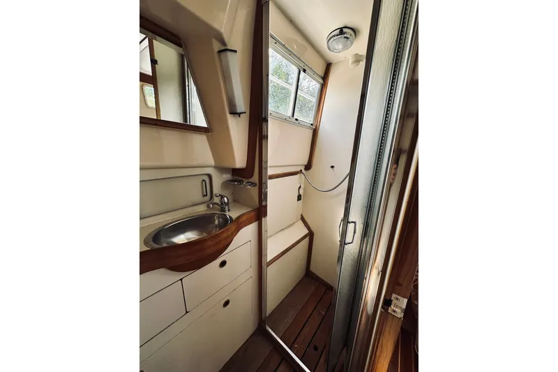 Slide: The Image of Bathroom interior of 1996 Sabreline 36 Sedan yacht with sink and shower. - 54