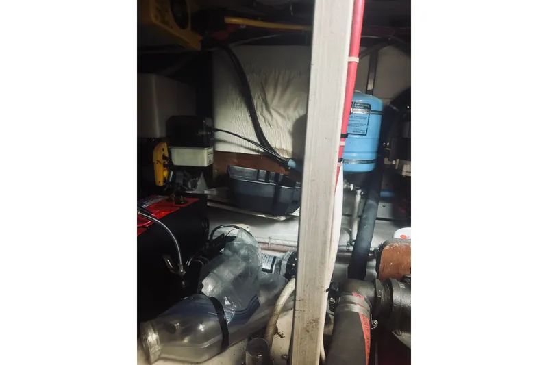 Slide: The Image of Engine room of a 1996 Sabreline 36 Sedan with various mechanical components. - 63