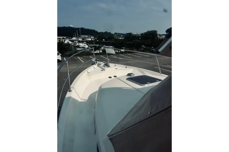 Slide: The Image of 1996 Sabreline 36 Sedan yacht deck view at marina. - 13