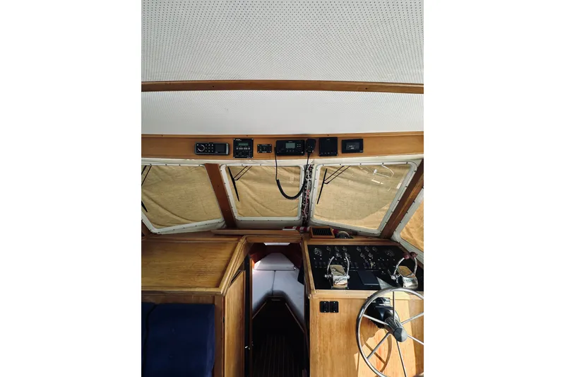 Slide: The Image of Interior helm of 1996 Sabreline 36 Sedan with navigation controls and steering wheel. - 33