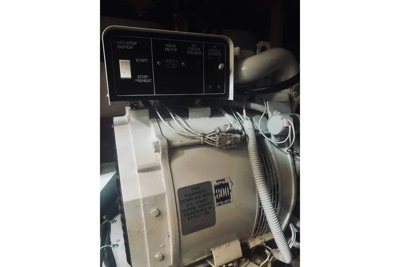 Slide: The Image of Engine compartment of a 1996 Sabreline 36 Sedan with control panel and wiring. - 59
