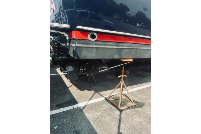 Slide: The Image of 1996 Sabreline 36 Sedan boat on stand, showcasing rear hull and exhaust detail. - 7