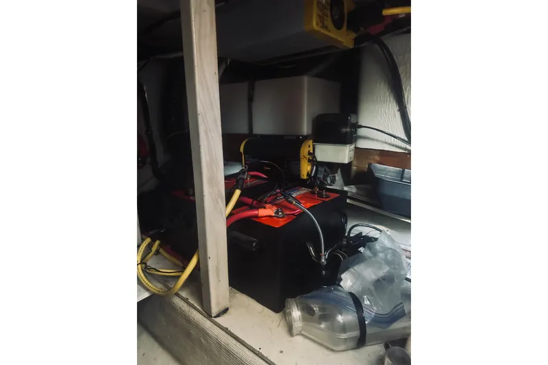Slide: The Image of Battery compartment of a 1996 Sabreline 36 Sedan with cables and equipment. - 62