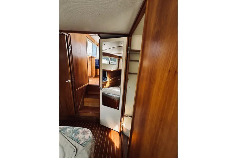 Slide: The Image of Interior of 1996 Sabreline 36 Sedan with wooden paneling and mirrored door. - 51