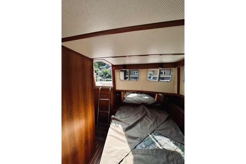 Slide: The Image of Interior of 1996 Sabreline 36 Sedan boat with wooden paneling and windows. - 56