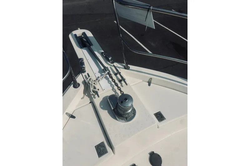 Slide: The Image of 1996 Sabreline 36 Sedan boat deck with anchor chain and winch. - 15
