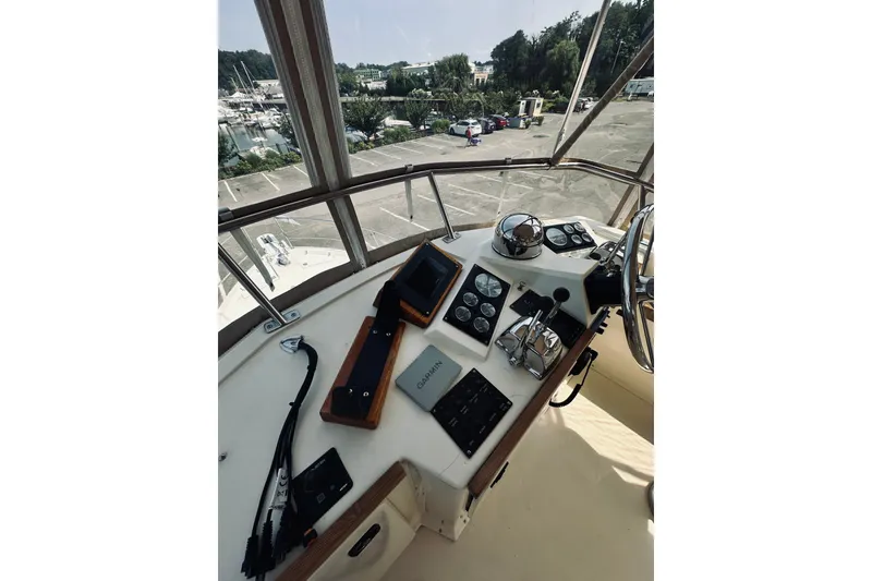 Slide: The Image of 1996 Sabreline 36 Sedan helm with navigation instruments and steering wheel. - 92
