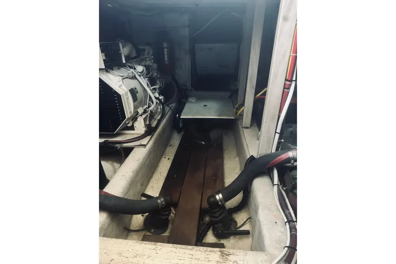 Slide: The Image of Engine room of a 1996 Sabreline 36 Sedan boat, showcasing mechanical components. - 57