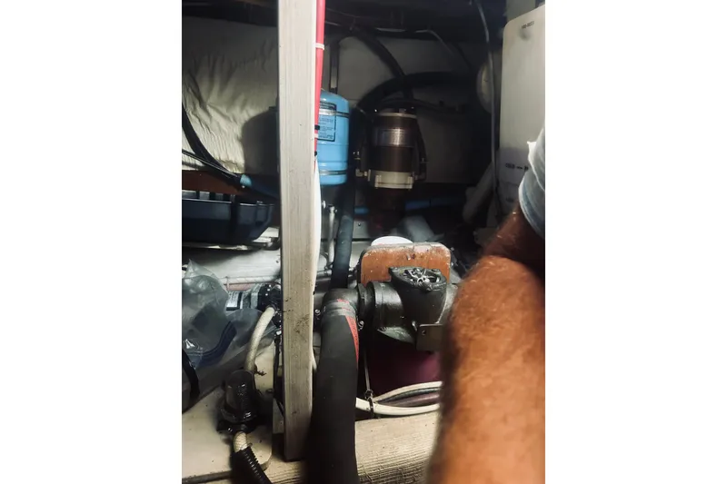 Slide: The Image of Engine room of a 1996 Sabreline 36 Sedan with visible mechanical components. - 64