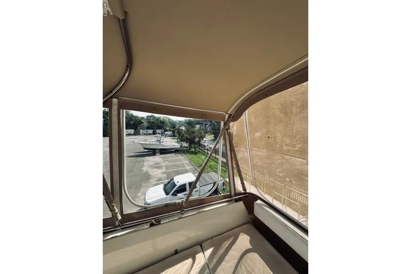 Slide: The Image of Interior view of 1996 Sabreline 36 Sedan with parking lot and vehicles outside. - 97