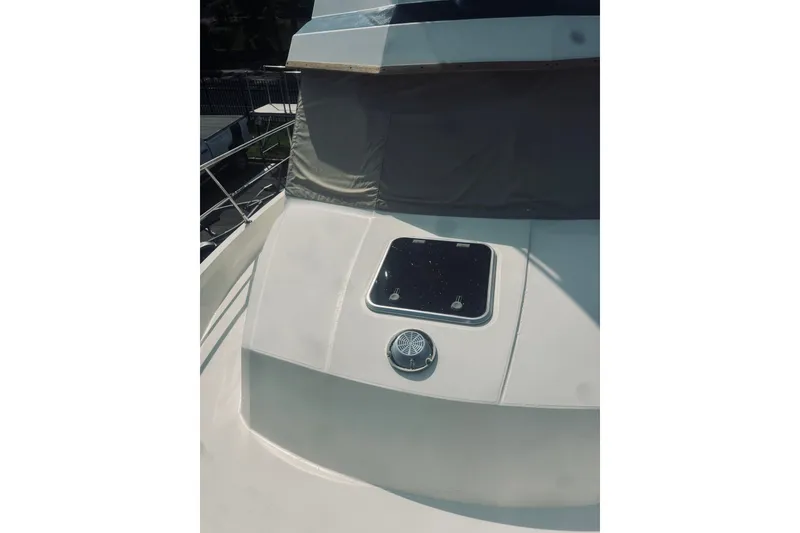 Slide: The Image of 1996 Sabreline 36 Sedan boat deck with hatch and railing. - 16