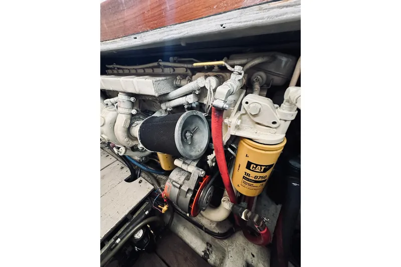 Slide: The Image of Engine compartment of a 1996 Sabreline 36 Sedan with visible CAT filter and components. - 75