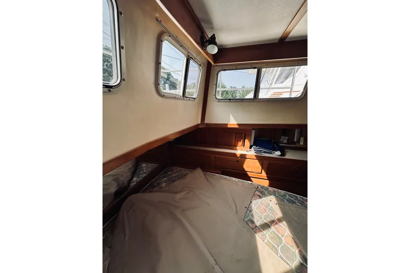 Slide: The Image of Interior cabin of 1996 Sabreline 36 Sedan with windows and wooden accents. - 48