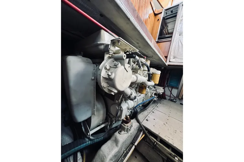 Slide: The Image of Engine compartment of a 1996 Sabreline 36 Sedan boat, showcasing mechanical components. - 67
